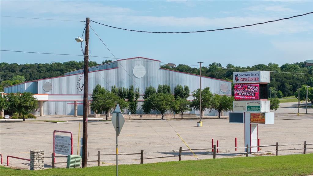 Somervell County Expo Center in the heart of Glen Rose includes a 130x254 heated and air conditioned Main Arena with 3,050 seating capacity that connects to a concourse area that includes a full service restaurant, western apparel store, and bar. The Showbarn Arena is 100x200 and the Warm up Arena under the covered pavilion is 215x120. Presently the facilities have over 350 animal stalls available. The Exposition Hall includes three different areas that can be separated by retractable walls or all used in tandem. This hall is used for banquets, proms, weddings, parties, dances, etc. Management office area includes four offices, a print room, storage rooms, and a conference room. Parking for 440 plus automobiles plus ample truck trailer parking. Includes 18 RV space hookups. All measurements are approximate. Active aquifer on property. Property is subject to a Right of First Refusal and interlocal agreement.