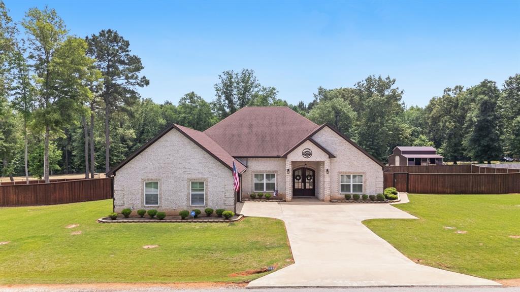Summer is calling in East Texas! This stunning three bedroom, three full bathroom home in sought after Bullard ISD was made for pool days and backyard nights. Built in 2019, it offers approximately 2.547 sq. ft. plus a flex space for a gym, game room or optional fourth bedroom. Step outside to your own private oasis featuring a resort style gunite pool, gorgeous stonework, water features, lush Tiff Bermuda grass, and a cozy outdoor fireplace ready for summer entertaining. Plantation shutters, and extended patio, and upgraded garage flooring add even more charm and convenience. Peaceful country living with quick access to Bullard, South Tyler, shopping, and medical facilities.  This home checks all the boxes! Future HOA projected at approximately $350 annually.