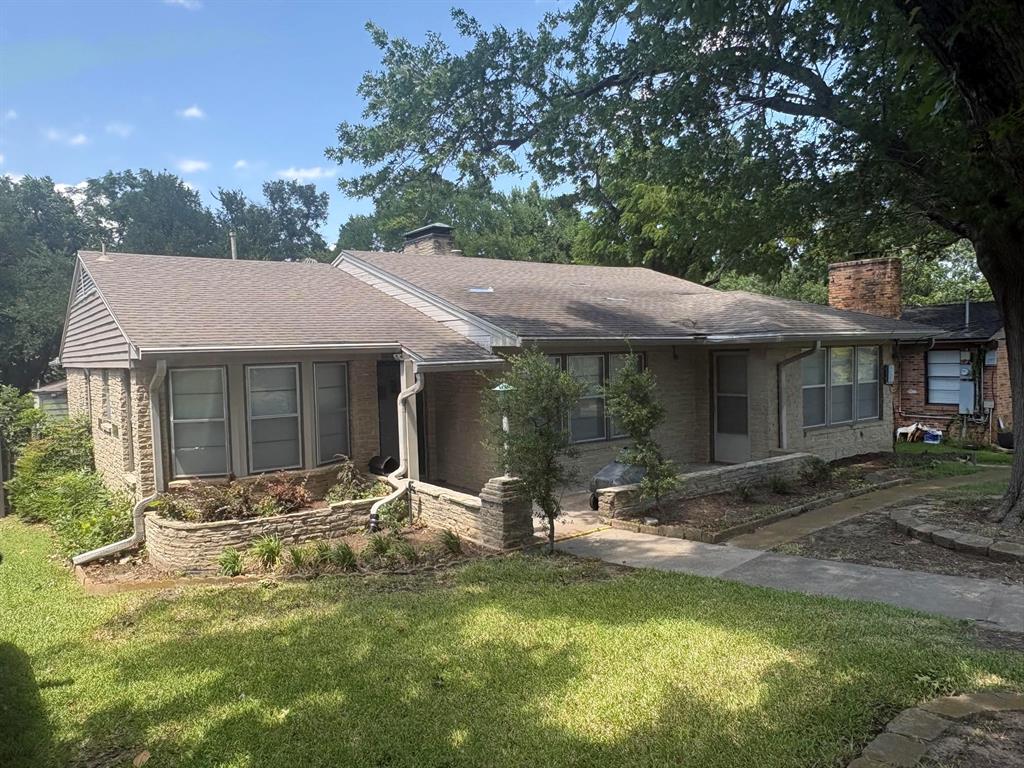 Location is everything, and this location is hard to come by. Nestled on a quiet cul-de-sac in the highly desirable West Kessler neighborhood, this charming, mostly original stone cottage is full of character and endless potential. Backing directly to the golf course, the backyard offers peaceful views and an exceptional tranquil setting. Inside, you'll find 2 beautifully preserved bathrooms with timeless change, gorgeous hardwood floors throughout, a gas stone fireplace in the living room, and abundance of natural light streaming through oversized windows in every room. The functional floor plan includes a two-car attached garage, sprinkler system and a new roof being installed. Whether you're looking to preserve its classic appeal or update it with your own personal style, this is a rare opportunity to create your dream home in one of the most sought-after locations in North Oak Cliff.