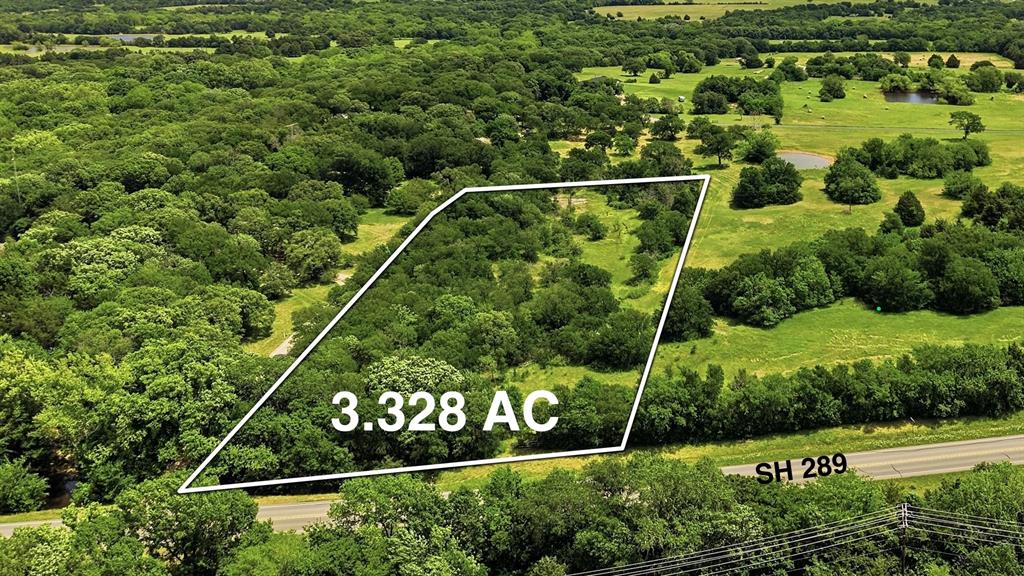Positioned along State Highway 289 with valuable road frontage, this versatile property offers exceptional potential for both commercial and residential use in a rapidly growing area. Located near Lake Texoma and only 30 minutes from Choctaw Casino, this property benefits from strong traffic exposure and increasing demand driven by ongoing area growth. Zoning flexibility makes this tract especially attractive, with the highest and best use aligning with B-2 General Business District, ideal for contractor yards, auto-related businesses, or retail with outdoor display. Additional potential uses include B-1 Light Commercial for retail, office, or service-based businesses, R-1 single-family residential development, and R-2 Duplex District for investment or multi-unit opportunities. Adding to the long-term value, there are proposed future plans for expansion of State Highway 289, which may further enhance accessibility, traffic flow, and overall commercial viability. City water and city sewer are nearby per the City- buyer to verify availability and connection requirements. Property is also subject to a waterline easement located along the far rear of the property.  An adjacent 3.269-acre tract is also available for purchase- See MLS 21257140, offering the opportunity to combine for a total of approximately 6.596 acres, ideal for larger-scale development or investment hold. This is a rare opportunity to secure a strategically located property with multiple use options in an area poised for continued growth. Please Note: Seller intends to record a restrictive covenant establishing a treed ‘no-cut’ privacy buffer (approx. 25’) along the north boundary of the property, helping preserve natural screening adjacent to the neighboring residence.