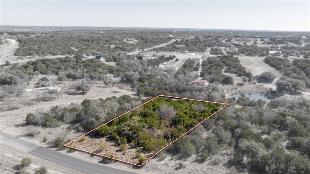 WATER VIEW!! This lot is on the inlet of Anglers Cove Lake in Mountain Lakes Ranch. This is your chance to build exactly what you’ve been dreaming about! No remodeling, no compromises, just a blank canvas and a whole lot of potential.
Positioned on the peaceful inlet, you’ll enjoy calm water views and a serene setting that feels like a weekend getaway every single day. Whether you’re envisioning a modern farmhouse, cozy lake retreat, or full-time dream home, this lot is ready when you are.
Mountain Lakes isn’t just a neighborhood, it’s a lifestyle. Residents enjoy two private lakes, a community pool, clubhouse, RV park, walking trails, and wide-open skies filled with Texas sunsets. Fish in the morning, float in the afternoon, and unwind under the stars at night.
Located in Bluff Dale, you get that small-town charm while staying just about 15 minutes from Granbury and Stephenville for dining, shopping, and everything you need. It’s the perfect balance of peaceful and practical.
