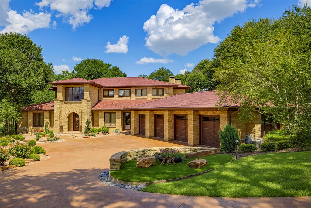 Nestled on an oversized lot overlooking the 11th hole in the prestigious gated and guarded Mira Vista community, this exceptional 4-bedroom, 4.5-bath estate seamlessly blends luxury, comfort, and breathtaking golf course views. Designed for both elegant entertaining and everyday living, the home features two spacious living areas, two dining spaces, and walls of windows that fill the interiors with natural light while showcasing the stunning outdoor setting. The expansive floor plan extends to a private balcony, a resort-style backyard complete with a sparkling pool, outdoor kitchen, putting green, and fire pit, creating the ultimate outdoor retreat. Additional highlights include a 4-car garage, water filtration system, and a full-home generator for peace of mind, and a recently installed Italian slate roof, offering timeless beauty and exceptional durability. This remarkable residence presents an extraordinary opportunity to enjoy refined living in one of Fort Worth's most sought-after golf course communities.