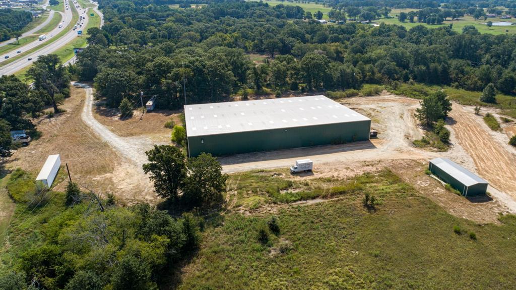 Prime Commercial Property with Warehouse off of the Eastbound Interstate 20 Service Road. Elevate your business with this expansive commercial property Situated on 13.93 ± acres.  On the property is a massive 30,000 square foot warehouse, designed to meet all your business needs. With two docks, the warehouse provides easy access for shipping and receiving, making it an ideal space for distribution, manufacturing, or large-scale storage. Additionally, the property features a 1,000 square foot metal pump house. This property boasts maximum visibility, making it a strategic location for businesses looking to capitalize on high traffic and easy accessibility. Whether you’re expanding your current operations or launching a new venture, this property provides the space, infrastructure, and location to support your business growth. Don’t miss out on this rare opportunity to secure a prime commercial property in Canton, Texas. Contact us today for more information or to schedule a tour.