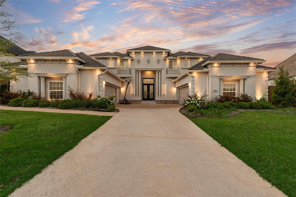 Nestled on .7 acres in coveted Southlake Manors, this stunning estate offers 6 bedrooms and 5.5 bathrooms with luxurious design at every turn. A grand double iron entry opens to a breathtaking foyer with a sweeping double staircase, setting the tone for elegance throughout. The impressive living room features soaring ceilings and a striking fireplace feature wall that doubles as a true statement piece. The chef’s kitchen is a showstopper, complete with a large island with waterfall quartz counters with hidden outlets, built-in Sub Zero refrigerator, Jenn-Air double ovens, Wolf 6 burner gas cooktop with griddle, and large walk-in pantry. The spacious dining room is filled with natural light from beautiful arched windows and elevated by designer lighting, while an intimate sitting area provides the perfect reading nook. The expansive owner’s suite is a private retreat, featuring a spa-inspired ensuite with dual vanities, freestanding tub, oversized shower with rain shower head, and a fully customized walk-in closet with hidden room. Upstairs, enjoy endless entertainment in the game room with bar and dedicated media room. A private guest suite and dedicated office are thoughtfully located on the first floor, offering flexibility for guests and work-from-home convenience. All secondary bedrooms are generously sized with walk-in closets, offering comfort and privacy for everyone. Step outside to a covered patio with a chic outdoor kitchen overlooking the oversized backyard. An extended concrete patio provides the perfect space to set up pickleball or tennis, and you have access to scenic trails just beyond the property. Ideally located near Westlake’s financial district and the prestigious Vaquero Club, this exceptional property blends luxury living with prime location.
