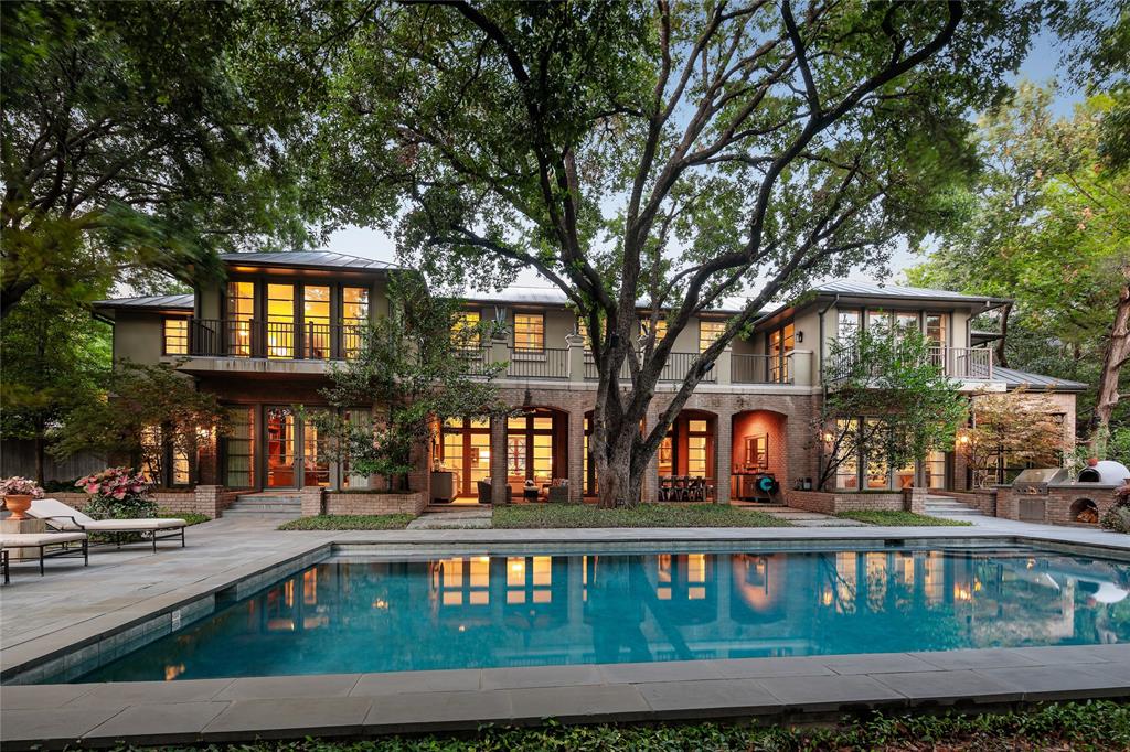 Experience an unparalleled world of luxury on over an acre of private lush grounds, in prestigious Old Preston Hollow. Updated & meticulously maintained w walls of windows in each rm providing you w serene living & designed for effortless indoor-outdoor entertaining. Backyard is an entertainer's dream; inviting covered patios, outdoor fire pit, built-in grill & pizza oven, pool-spa, tennis court & grassy yard all overlooking creek. 1st flr featrs light & bright kitchen w brkfast rm, spacious formals, office, guest suite & workout rm. Primary suite up w oversized balcony, walk-in closet. 2nd flr has private guest suite w separate exterior access. Abundant parking w large circle drive and 2-car attached garage.