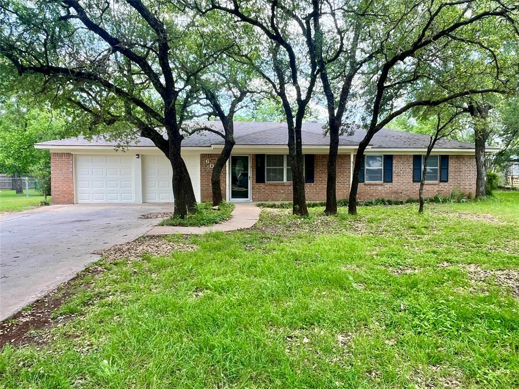 Charming 3 bedroom, 2 bath brick home with 2-car garage located in one of Hamilton’s most desirable neighborhoods! This lovely property offers 1,597 sq. ft. of comfortable living space on a spacious .39-acre lot with a fenced backyard—perfect for kids, pets, and outdoor entertaining.

Recent updates include a new roof replaced in July 2023, fresh exterior paint, updated exterior doors, and additional fresh paint enhancements that give the home a clean, refreshed look and added curb appeal. Inside, you’ll find a functional layout with a large living area, open kitchen and dining space, and comfortable bedrooms designed for everyday living.

Enjoy small-town living with the convenience of nearby schools, shopping, and parks. This move-in ready home combines comfort, charm, and valuable updates in a highly sought-after area of Hamilton!