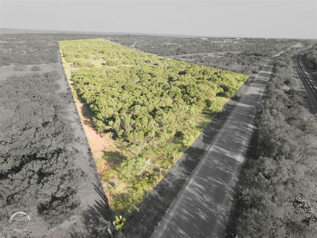 This 24-acre raw land in Jim Ned school district offers abundant trees and stunning panoramic views, creating an ideal canvas for your custom dream home. Please note that water meter feasibility is currently pending.  Additional 24 acres to the north could be sold together.