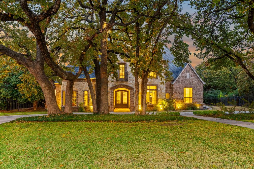 Set on an exceptional lot in one of Southlake’s most desirable locations, this 5-bedroom, 6-bath, 6,600-square-foot residence offers a rare sense of privacy and connection to nature. The backyard backs to Army Corps of Engineers land, creating a protected greenbelt that extends toward Lake Grapevine, preserving peaceful views and privacy. Designed for both everyday living and elegant entertaining, the home features expansive living spaces filled with natural light. Sliding glass doors seamlessly open the main living area to the outdoors, inviting the patio and backyard into the heart of the home. The covered patio overlooks an incredible pool and spa, creating a resort-style setting ideal for relaxing or hosting guests. A playroom located just off the kitchen adds functionality and flexibility, while the private sport court provides space for recreation. The outdoor setting is tranquil and park-like, enhanced by mature trees and the quiet beauty of protected land beyond the backyard. Located in the heart of Southlake and zoned to award-winning Carroll ISD, this home offers refined luxury, thoughtful design, and a setting that feels both private and effortlessly connected to nature—just minutes from Southlake Town Square, dining, and shopping. 3049 Loch Meadow will capture your heart and imagination. Book your showing today!