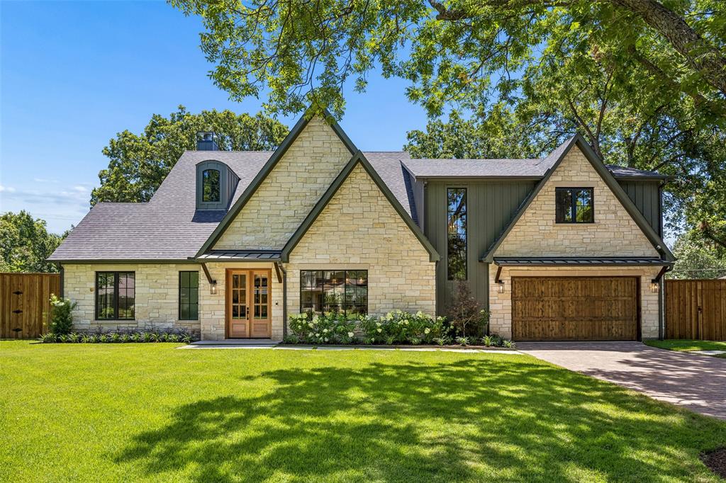 Tucked into the established and highly desirable neighborhood of Casa Linda Estates, 9906 Losa is a newly constructed modern tudor. The builder thoughtfully crafted a home that fits the neighborhood, with an Austin Stone facade and a complementary color palette. Situated on over a third of an acre, with mature trees, this home commands a presence without being pretentious. From the moment you step through the front door into the foyer, you’ll notice a distinct departure from the cookie-cutter new build. This home will wow you in all the right ways. White oak floors, arched doorways, gorgeous custom millwork, and other meticulous details that you will notice with every glance. The floorplan is exceptionally thoughtful as well, designed to strike that perfect balance between grand-scale entertaining and quiet, everyday comfort. The first floor at ~2,700 square feet includes the kitchen with a scullery, living room with vaulted ceiling, formal dining, primary suite, one guest room suite, powder bath and a laundry room. On the second level are two generously sized bedrooms, with a shared jack and jill bathroom, a game room, a media room and a library nook. The backyard is a sanctuary, with a large covered patio big enough for a sitting and dining area, freshly laid Zoysia grass and two massive Burr Oak trees to provide dappled shade throughout the day. Plenty of room to add a pool and still have a huge backyard. Located just minutes from White Rock Lake and the Arboretum and walking distance to dozens of shops and restaurants, this location offers peaceful surroundings with quick access to all that East Dallas has to offer.