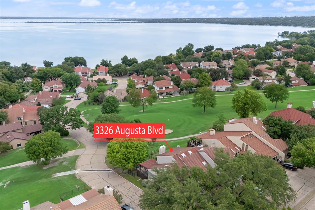 Beautifully updated home in the gated resort community of Lakeside Village in Rockwall. This meticulously maintained home overlooks the 6th hole of the golf course and has stunning lake views! Fantastic location right off of I30. Close to shopping, dining, medical, entertainment, downtown Rockwall, Lake Ray Hubbard etc. This home is set up for seamless indoor and outdoor entertaining. Open floor plan with lots of windows and skylights that bring in plenty of natural light. Spacious living room with a designer fireplace is perfect for large get togethers. The adjoining family room has a wall of built-ins and French doors leading to the expansive covered deck with fabulous views of the golf course and lake! Chefs kitchen with granite counter tops, walk-in pantry, plenty of cabinets and views of the lake! The dining area has room for an oversized table and has lots of natural light. The spacious owners suite has a luxury spa-like ensuite bath with dual vanities, walk in shower and four closets as well as a private balcony with stunning golf course and lake views for you to enjoy with your morning coffee or while reading a book. A spacious bedroom (great for guests, home office, etc.) and an updated full bath with walk-in shower are on the main level. Lots of room upstairs with two secondary bedrooms. One is large with a private office, game room or media room allowing for many uses. The utility room has space for a refrigerator.  This home will not disappoint! Lakeside Village is a gated community with premium HOA amenities: a 9-hole executive golf course, two resort-style community pools, tennis and pickleball courts, playgrounds, secure RV and boat storage, and easy access to the lake. With golf course frontage, generous living space, and thoughtful updates, this home offers a lifestyle of privacy and relaxation in one of the area’s most desirable neighborhoods. This home will not disappoint! Now it is your turn to enjoy all it has to offer! Rockwall ISD! Don't miss!