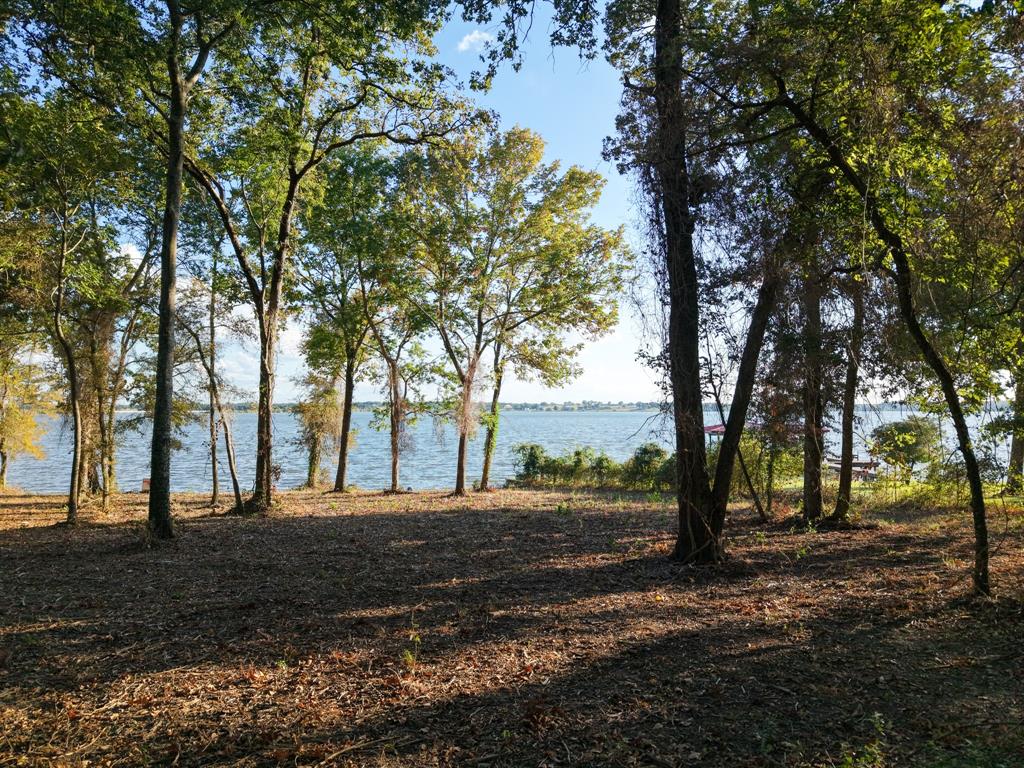 Your lakefront getaway awaits on the shimmering shores of Lake Limestone, one of Texas’ most scenic and peaceful lakes. This gorgeous 1.12-acre property is nestled among mature trees and showcases wide, breathtaking open-water views that create the perfect backdrop for your future home. Wake up to the sparkle of sunlight dancing across the water and end your evenings with stunning lakeside sunsets.

Whether you envision quiet mornings by the shoreline or fun-filled days of boating, fishing, and jet skiing, this property delivers the full lake-living experience. With plenty of space to design the lake house you’ve always dreamed of, this is a rare opportunity to own truly beautiful waterfront land. Come experience the magic of Lake Limestone for yourself.