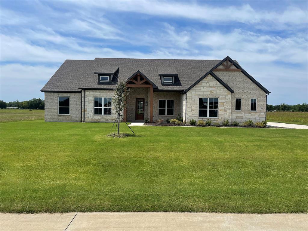 Set on a sprawling one-acre homesite in the sought-after Waterfall Estates, this beautiful home offers the perfect blend of comfort, space, and elevated design. Featuring 4 generously sized bedrooms and 2.5 bathrooms, the layout is thoughtfully crafted for both everyday living and effortless entertaining. At the heart of the home, an expansive family room invites gatherings of all sizes, filled with natural light and an easy welcoming flow. The kitchen is truly exceptional , showcasing a striking waterfall granite island, an oversized walk-in pantry, and abundant space for cooking, hosting, and making memories. Just off the kitchen, the dining area provides the perfect setting for everything from intimate family dinners to lively celebrations with friends. Continued... See Addendum Property Description 1