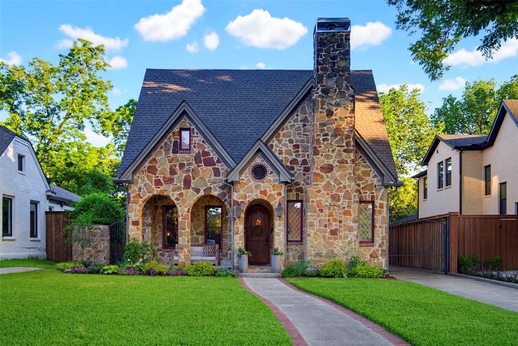 M Streets. Greenland Hills. Period architecture that ages gracefully. 3,934 combined square feet. Main house with fully independent, attached guest suite above the garage. Proximity without sacrificing boundaries. Architecture solving real life. Jeff Baron built this in 2008: classic M-Streets charm without the 1920's upkeep. Mockingbird Elementary zoning. Main house: four bedrooms, office, two living rooms, dedicated dining. Formal living with brick fireplace framed by custom millwork & leaded glass windows. Open living with stone fireplace connecting kitchen, breakfast nook, backyard. Command center for cooking, hosting, homework, life. Kitchen built for output. Massive island. Granite counters. Commercial gas range. Dual ovens. Stainless appliances. Cabinet storage. Butler's pantry with wine fridge, wet bar. This kitchen performs daily. Dedicated dining room. Upstairs: four bedrooms. Full bath. Laundry room with sink. Primary suite goes next level. Fireplace. Deep soaking tub. Separate walk-in shower with privacy & scale. Dual sinks. Walk-in closet. Boutique hotel vibes baked in. Guest suite: 656 sq ft attached above garage. Living room. Full kitchen with island & granite. Bedroom. Ensuite bath. Separate entrance through mudroom. Connected, but independent.  Mother-in-law proximity with boundaries. Friend suite between chapters. Solves problems most houses ignore. Oversized garage below. Epoxied floors. Room for a gym and hobbies. Outside: covered patios, lush beds, manicured yard, mature tree canopies. Green space without servitude. Roof just installed and dialed in. Four-car driveway. Parking handled. Easy access to the all the highlights of East Dallas: Katy trail access a quarter mile away,  Lower Greenville, Knox Henderson, White Rock Lake. Homes the neighborhood protects with integrity. Central Dallas access. Period charm. Modern bones. Two full kitchens. One property solving multiple lives. Turnkey execution. Welcome home.
