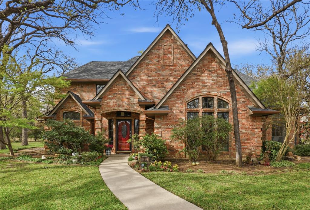 Tucked away on a private half-acre lot at the end of a quiet cul-de-sac, this stunning home is located in an exclusive gated community of just 24 homes, offering a rare blend of privacy and convenience. From the moment you step inside, you’re welcomed by rich hardwood floors, abundant natural light, and beautifully curated finishes throughout. The inviting living room features soaring cathedral ceilings, a cozy wood-burning fireplace, and custom built-ins—creating the perfect space for both everyday living and entertaining. The formal dining room is filled with natural light from floor-to-ceiling bay windows and enhanced by a chandelier and vaulted ceiling. The fully remodeled kitchen showcases quartz countertops, tiled backsplash, updated appliances, double oven, and ample cabinetry, while the adjacent breakfast area includes a bar-height island and built-in coffee bar, seamlessly connecting the home’s main spaces. The spacious primary suite offers tray ceilings, serene views, a sitting area, and a spa-inspired bath with a walk-in shower, dual vanities, penny tile flooring, and updated lighting. A large downstairs office with built-ins provides flexible space for work or hobbies. Upstairs features four additional bedrooms, including one with a private bath, a versatile central space ideal for a game or playroom, and two bedrooms connected by a Jack-and-Jill bath. Outside, enjoy the expansive backyard with beautiful landscaping, winding walkways, a firepit, and the calming sound of a nearby pond fountain, plus a long side driveway for extra parking and play space. Residents also enjoy access to a community pool and tennis courts without the maintenance. Zoned for Hawk Elementary, Crownover Middle, and Guyer High School.