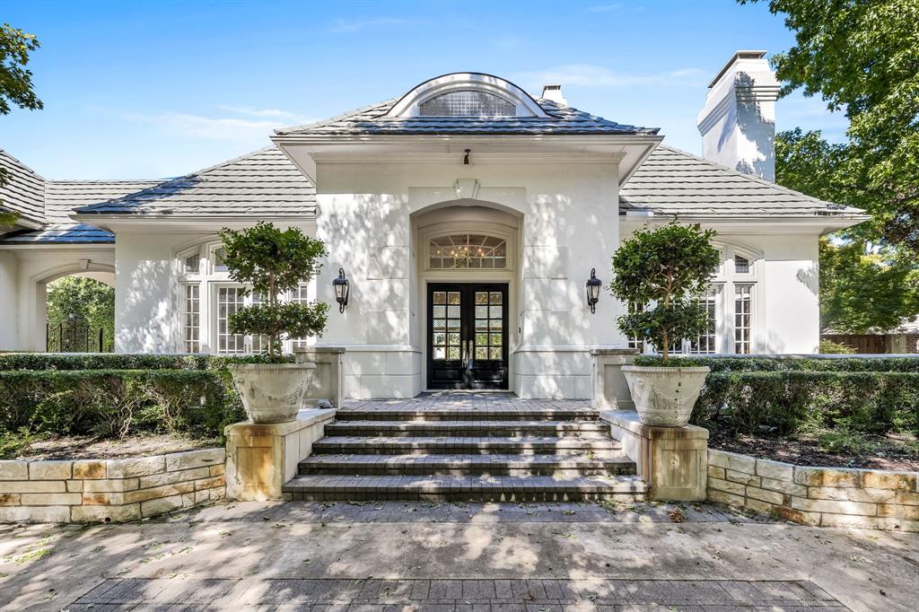 Breathtaking, one of a kind light and bright modern Plano, Willow Bend Place home! Large French doors provide ample natural light as you enter this beautiful home. The study features gorgeous wood paneling and a grand fireplace. The formal living room features a panoramic view of the backyard oasis. The primary bedroom boasts a fireplace and bow windows which provide a view of the pool and surrounding greenery. The spacious primary bathroom will feel like an absolute dream with a beautiful chandelier and expansive walk-in closet with extensive built-ins. The kitchen is a chef's paradise with designer finishes, a large island, 6-burner Wolf stove with griddle, dual oven, and walk-in pantry. The secondary living room boasts floor to ceiling windows with a view of the backyard. Additionally, this home features a large game room, secondary bedrooms with walk-in closets, built-in outdoor grill and sink, covered patio, pool, fantastic view of Gleneagles Queens Course 4th hole, gated drive, and so much more! The only thing this home is missing is YOU!