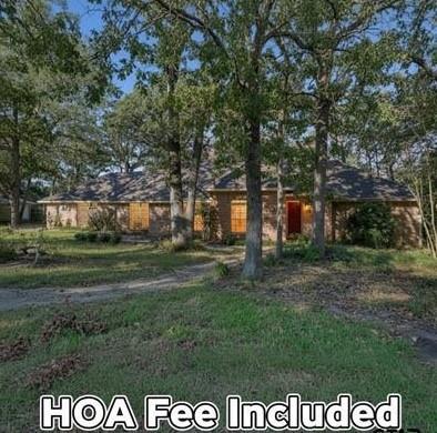 Welcome home to this beautiful 3-bedroom, 2-bathroom retreat offering 2,534 sq. ft. of inviting living space in the gated community of Hideaway Lake! From the moment you enter, you’ll appreciate the open and functional layout, perfect for both everyday living and entertaining guests.

Step inside to find a spacious living room with abundant natural light, a cozy fireplace, and elegant finishes that create a warm, welcoming atmosphere. The kitchen is designed for both style and function — featuring ample cabinetry, granite countertops, a breakfast bar, and a charming dining area ideal for family gatherings.

The primary suite offers a relaxing escape with a spa-like ensuite bathroom complete with dual vanities, a soaking tub, and a separate shower. Wait until you see the size of the primary closet! Two additional bedrooms provide flexibility for guests, a home office, or hobbies. The home also features an additional living space and large storage area. 

Enjoy the peaceful backyard setting with mature trees and a covered patio — perfect for morning coffee or evening relaxation.

Located in the heart of Hideaway, residents have access to resort-style amenities, including three sparkling lakes for fishing and boating, 27 holes of championship golf, community pools, tennis and pickleball courts, dining facilities, and a variety of clubs and social events.

Experience the best of East Texas living where comfort, convenience, and community come together beautifully. This home is move-in ready and waiting for its next owner to fall in love!
