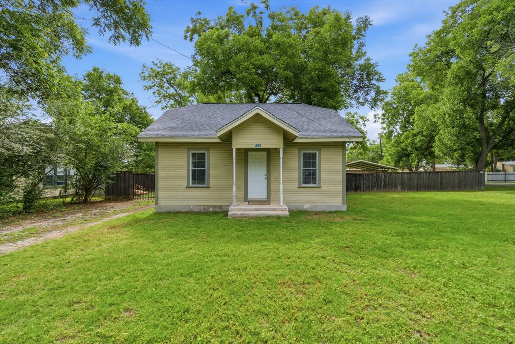Located in the heart of De Leon, Texas, this charming move-in ready 2 bedroom, 1 bathroom home offers comfort, character,
and convenience all in one package! With 988 square feet of warm and inviting living space, this home features beautiful high
vaulted ceilings that create an open and spacious feel throughout. The kitchen offers classic oak cabinets with plenty of
storage and charm, while central heat and air conditioning provide year-round comfort. Recent updates include durable
Hardi-board siding, updated electrical and plumbing, and a high impact roof. Situated on a quiet corner lot with several mature trees, the property offers a welcoming atmosphere and plenty of outdoor enjoyment. The large front yard adds curb appeal, while the
privacy fenced backyard is perfect for family gatherings, pets, or simply relaxing in your own
private space. A separate one-car garage provides parking or storage options, and the covered
patio area behind the garage creates the perfect setting for grilling, entertaining, or unwinding after
a long day. Whether you are a first-time home buyer, looking to downsize, or searching for a simple and
low-maintenance lifestyle, this home is a must-see!