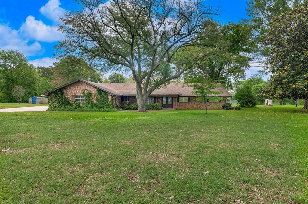 Situated on over 5 acres, this spacious property offers privacy, functionality, and room to spread out. The home features 3 bedrooms, 2.5 bathrooms, two living areas, a formal dining room, and a very large sunroom perfect for relaxing or entertaining. The kitchen and laundry room are generously sized, providing ample space and storage.

Outside, the property truly shines with a 3-car garage, a large storage building with roll-up door, a garden house, and a huge metal shop with two roll-up doors—ideal for hobbies, equipment, or additional storage. With no rear neighbors and convenient access to I-220, this property offers both seclusion and accessibility.