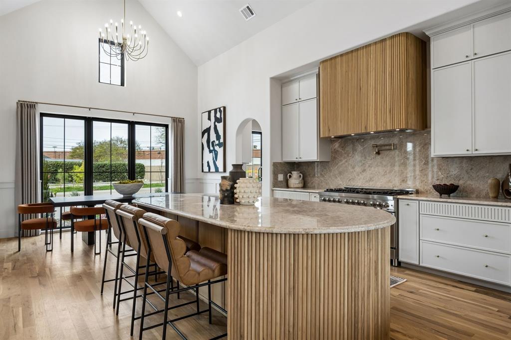 A fresh take on modern luxury, this newly built 4-bedroom, 4 full and 1 half-bath home by Madison Custom Homes offers 3,013 square feet of thoughtfully curated living space where clean design meets everyday functionality. Each bedroom features its own en suite bathroom, creating a private and comfortable layout ideal for both residents and guests.
The main living area flows effortlessly into the kitchen and dining space, making it perfect for entertaining or day-to-day living. A butler’s pantry, powder bath, and dedicated laundry room add both convenience and intention to the layout. The living room is anchored by a striking floor-to-ceiling stone fireplace and filled with natural light, creating a warm yet elevated feel.
Designed with both style and performance in mind, the kitchen features a large island, commercial-grade ZLINE appliances, and a sleek, modern aesthetic. True white oak hardwood floors run throughout the home, complemented by custom exterior doors from Love That Door and Andersen 100 Series windows made from Fibrex composite for superior durability and energy efficiency.
The primary suite offers a private retreat with vaulted ceilings, abundant natural light, and a dedicated sitting area. The spa-like en suite bath includes heated floors, a soaking tub, expansive walk-in shower, and a spacious custom walk-in closet.
Outside, enjoy beautifully landscaped grounds, a large grassy yard, and a covered patio with a built-in grill area, perfect for entertaining year-round.
Ideally located in North Dallas, this home offers convenient access to major thoroughfares including the Dallas North Tollway and President George Bush Turnpike, making commuting a breeze. Just minutes from top shopping, dining, and everyday essentials, the location combines neighborhood charm with exceptional accessibility.