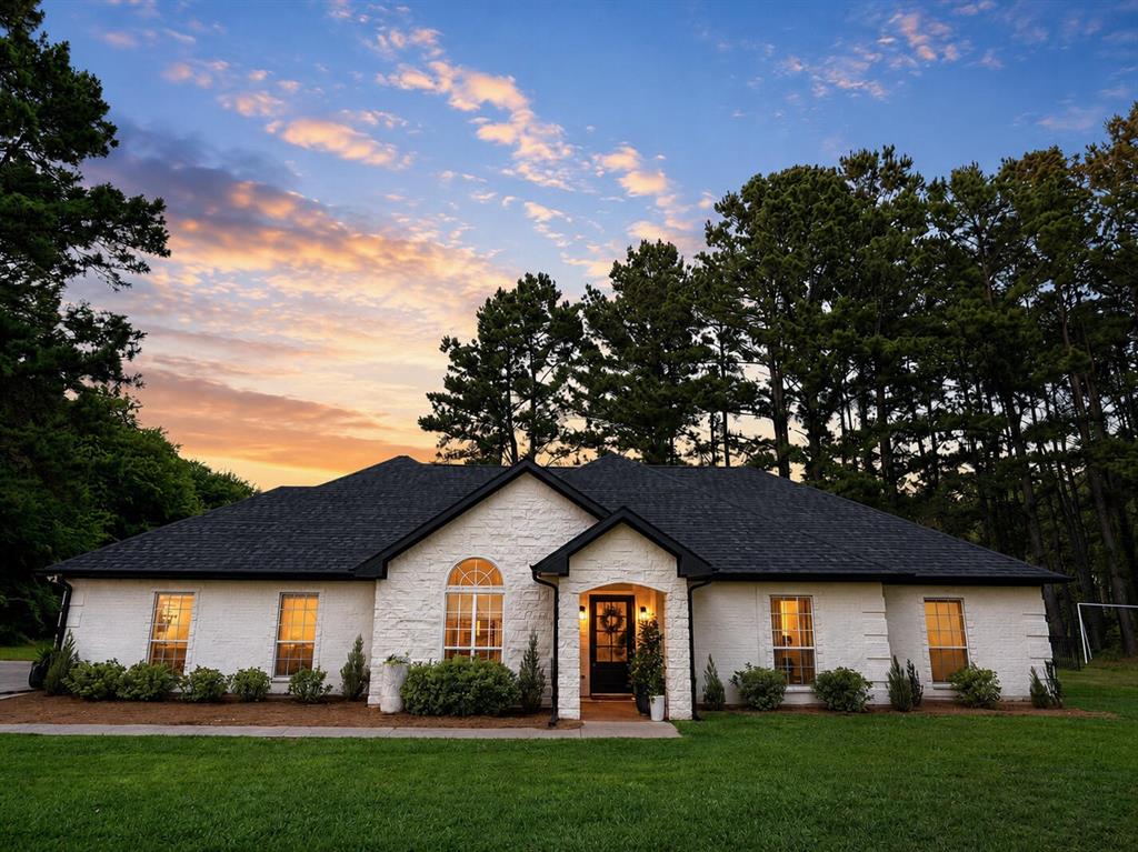 Situated on 3 private, tree lined acres inside the loop in Athens, this custom built home was originally constructed by a local custom home builder as a personal residence and has had only one owner since the builder. Just over one mile from downtown and within walking distance of Cain Park and the YMCA, the property combines the privacy and space of country living with the convenience of being close to town.

Surrounded by mature pine trees, the property features a scenic pond with views from the home. Located outside city limits, the property benefits from county taxes only, resulting in significant annual savings compared to many nearby neighborhoods.

The home has 4 bedrooms, each with a walk in closet, 2 bathrooms, and a large 2 car garage with additional storage and a heated and cooled storage closet. Thoughtful built in storage throughout the home enhances functionality and organization, including custom built ins in the primary closet.

Inside, hardwood flooring runs throughout the main living areas, leading into a large 28' x 12' kitchen with granite countertops, custom stained wood cabinetry, upgraded stainless steel appliances, formal and casual dining spaces, and a walk in pantry. The primary suite includes an ensuite bath, spacious walk in closet with custom built in storage, and direct access to the laundry room.

Additional features include a large patio overlooking mature pine trees and the pond, a gated backyard area for pets, pond access with excellent fishing, and a 12' x 16' workshop building with electricity for storage, hobbies, or equipment.

Recent updates include a Class III impact resistant roof and gutters replaced in Winter 2024. The home has also recently completed a clean inspection.

Inside the loop yet surrounded by mature pine trees and pond views, the property has a unique combination of privacy, acreage, county taxes only, and convenient access to downtown Athens.