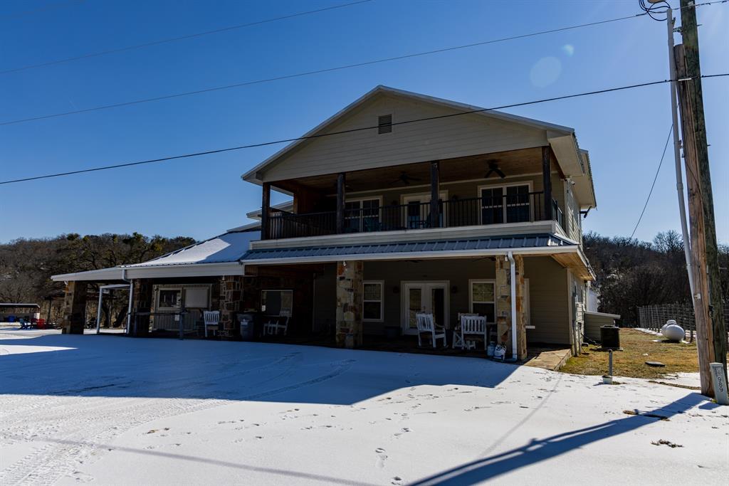 This exceptional multi-use commercial property in Graham, Texas offers a rare combination of existing income, flexible space, and significant room for expansion. Located less than one mile from the historic town square—known as the largest town square in the United States—the property benefits from steady tourism, community events, and strong local traffic.

Currently operating as a successful bed and breakfast, the main building features four spacious guest bedrooms and four full bathrooms, along with a welcoming kitchen and comfortable living and dining areas designed to create an inviting atmosphere for guests. A charming front porch provides an ideal place to relax and enjoy the peaceful surroundings.

The property also includes a separate bar and entertainment space located under the same roof but with its own private entrance, offering the perfect setup for nightlife, private events, or additional hospitality services. This unique configuration allows multiple business concepts to operate simultaneously on the property.

Outside, the property expands into a versatile outdoor area complete with a stage and multiple seating and gathering spaces. The open land offers tremendous flexibility for additional income-producing uses such as an event venue, live music venue, outdoor sports bar, food truck park, RV park, family restaurant with outdoor games, farmers market, plant nursery, or weekend flea market.

Positioned directly on the major state highway between Graham and Breckenridge, the property offers excellent visibility, accessibility, and consistent drive-by traffic—ideal for attracting both locals and visitors.