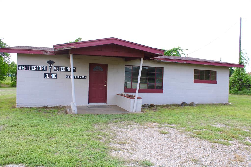 HISTORIC LOCATION NOW AVAILABLE IN WEATHERFORD TEXAS !!!!  A LOCAL LEGEND and REVERED PARKER COUNTY VET has decided to hang it up after 70 years !!!  OUR LOSS is YOUR GAIN !!!! 2301 MINERAL WELLS HWY !!!   LOCATION , LOCATION, LOCATION  !!! US HWY 180 WEST at RIC WILLIAMSON LOOP,  just west of the PARKER COUNTY SHERIFF'S POSSE GROUNDS.  Vintage cinder block office and warehouse. 1.5 ACRES with water well and traditional septic. PROUD HOME OF A FIGHTING TEXAS AGGIE CLASS OF 1953 !!!!
