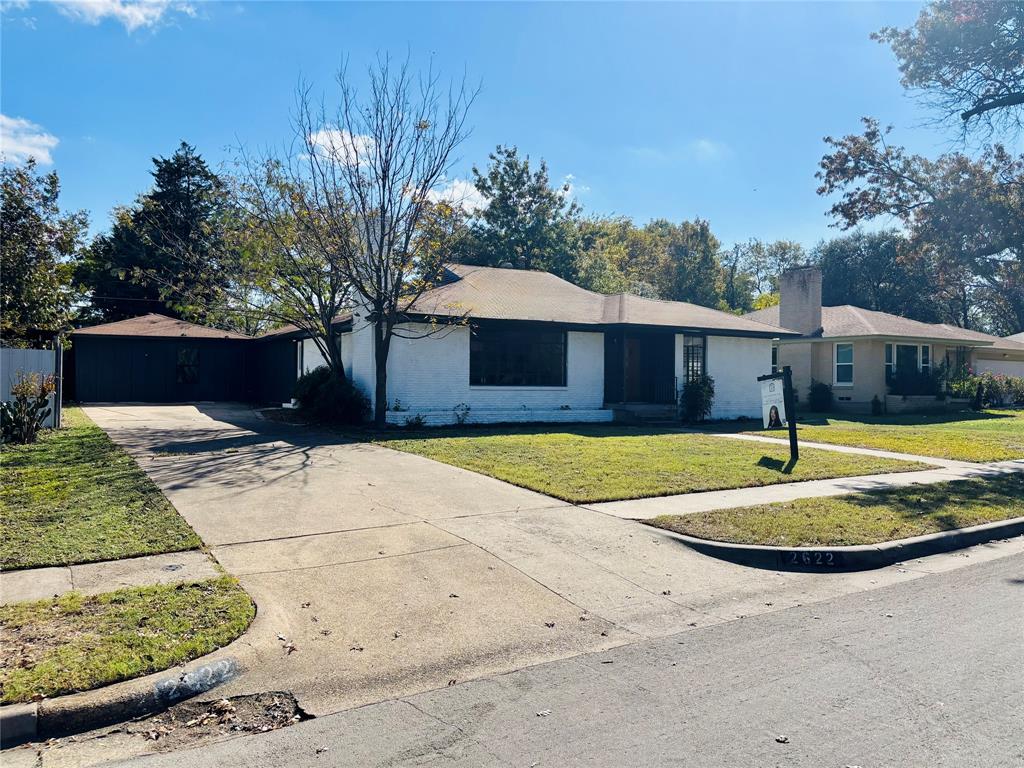 Location, Location, Location. Walking distance to soon to open Target, LA Fitness and many more popular retail stores & restaurants at Wynnewood Village.  $15,000 available for non-first time buyer. Come see this beautifully restored mid-century modern property. The kitchen boasts of renewed cabinetry, quartz countertops and smart black stainless steel Samsung appliances. A roomy pantry awaits to be filled and the great open floor plan will suit any size of gatherings, intimate or large with its beautiful attractive island as you cook over it. Dining spaces are large and versatile and flow directly into the large living room and fireplace with grand windows that reflect so much natural lighting through the house. Gaze upon the original and restored hard wood floors as they lead you through from the living room into the large bedrooms where you will be met with more windows that bring in more natural lighting into the bedrooms. This home features two master bedrooms with a large hallway that leads to a private back master bedroom and in-suite full shower. Each bedroom is large with much space. HVAC has been replaced.