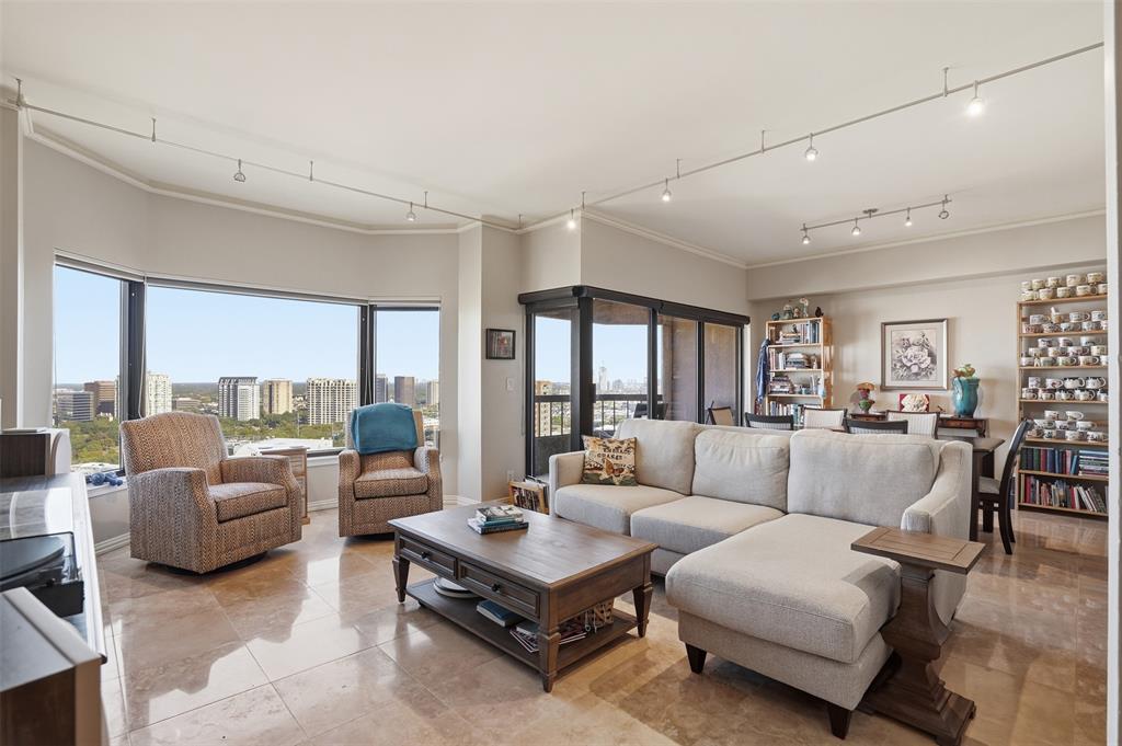 Perched on the 22nd floor of La Tour in the heart of Uptown, this sophisticated condominium offers sweeping, unobstructed city views through expansive picture windows that flood the home with natural light. The open living and dining area features neutral finishes, tile flooring, and access to a private balcony, creating an ideal space for both everyday living and entertaining. The well-designed floor plan includes a spacious living room, a defined dining area, and an efficient kitchen with ample cabinetry and countertop space. The split-bedroom layout provides privacy, with a generous primary suite, walk-in closet, and en-suite bath, plus an additional bedroom and bath for guests or a home office. Residents of La Tour enjoy 24-hour concierge, pool and spa, fitness center, tennis court, club room, and secure parking. Step outside to experience the best of Uptown living—Katy Trail, West Village, top restaurants, and shopping are just moments away. This is your opportunity to own a high-rise retreat with beautiful skyline views in one of Dallas’ most walkable neighborhoods. Two deeded parking spaces and a storage unit is included!