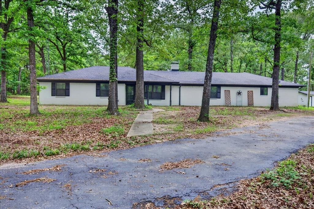 Beautifully updated four bedroom 3 bath home setting on 4.7 acres in a very nice neighborhood just waiting for its new owners. This home is great for a larger family or for a family that needs a mother in law suite. Updates include a new roof on the house, garage and shop, gutters, windows, countertops, bathroom vanities, some flooring and painted inside and out. If you like seclusion then this is the property for you so dont waste any time and come take a look. This home comes with a Lifetime Transferable Warranty on the slab and will provide a Home Warranty. Seller is willing to Seller Finance with half the money down. Priced way below appraisal value. Seller offering $10k concessions with full price offer.