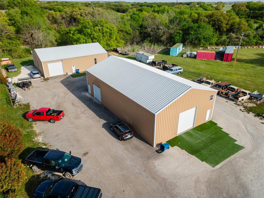 Don't miss out on this unique opportunity to elevate your business presence in the thriving community of Acton, TX. Investing in this commercial property presents a rare chance to acquire a strategically located and highly adaptable space. If you are a car enthusiast and need a great place to showcase your collection or you are looking for a new business venture, the possibilities are endless. Ideal for a variety of commercial purposes including retail, office space, or a restaurant. Shop 1: Measuring 40x60 feet, this shop provides ample space for various business activities. Shop 2: Slightly larger, this second shop spans 40x70 feet. Both shop buildings have restrooms and offices and are insulated to maintain an optimal climate for operations and storage.A newly constructed carport has been added to the property, offering additional storage space for supplies or extra vehicles. This feature enhances the functionality of the location, allowing business owners to keep their resources organized and readily accessible. Located outside the city limits! Don't delay making this your new business endeavor! SELLER FINANCING CONSIDERED WITH NEGOTIABLE TERMS