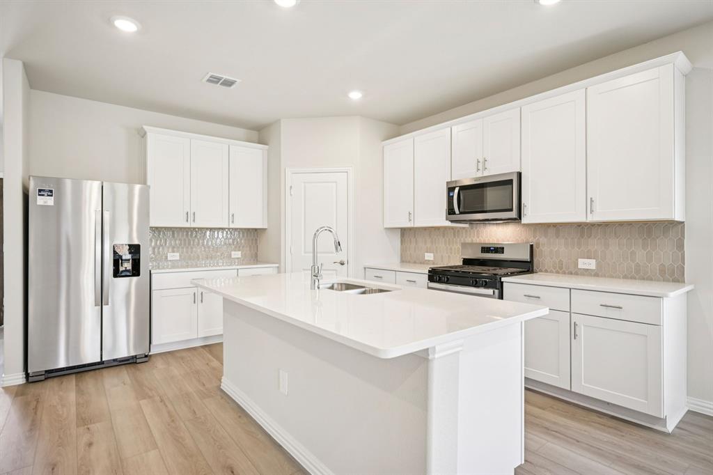 BRAND NEW energy - efficient home Aug 2026! Skip your commute and work from home in flex room turned home office. White cabinets with veined white quartz countertops, muted beige EVP flooring with light taupe carpet. New energy-efficient move-in ready homes in Dallas-Fort Worth include a washer, dryer, fridge, and whole home blinds, plus they can be closing-ready in 60 days or less–guaranteed. Have it all: Relax in your private primary suite, enjoy the covered back patio, and our open concept floorplans, all with easy access to Fort Worth, Arlington, and Grapevine.