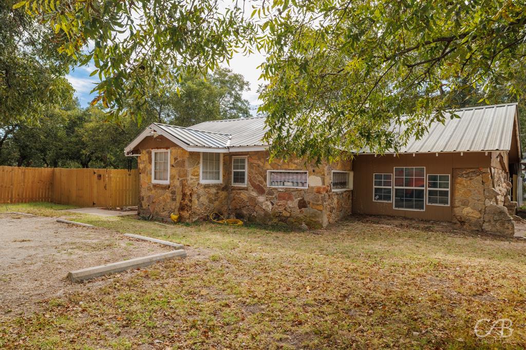 Charming 3-bedroom, 1-bath home situated on a spacious corner lot! This inviting property offers an open-concept layout that seamlessly connects the kitchen and living areas—perfect for everyday living or entertaining guests. Enjoy easy-care laminate flooring throughout, adding to the home’s warm and welcoming feel. Outside, the large yard is fully enclosed with a brand-new privacy fence and features seven fruit-bearing trees, creating your own little orchard right at home. A wonderful blend of comfort, space, and outdoor enjoyment!