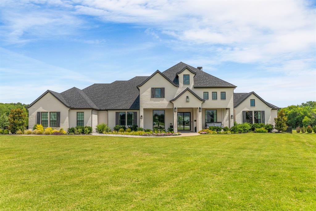 Stunning Owens Warford Custom Home with 5 bedrooms and 4.5 baths on 2 acres in a quiet cul-de-sac within a gated community in highly acclaimed Lovejoy ISD. This thoughtfully designed home features a dedicated office, spacious living areas, split secondary bedrooms, with wood flooring and custom touches throughout. The gourmet kitchen boasts high-end appliances, including a 6-burner cooktop with griddle, double ovens, wine fridge, and a walk-in pantry equipped with a second refrigerator, microwave, dishwasher, and ice maker. Additional upgrades include an Aquasana whole home water purification system, a safe room and a dog washing station.

Enjoy resort-style outdoor living with a large covered patio featuring a fireplace, built-in grill, and Green Egg, offering plenty of space for entertaining. The backyard oasis is complete with a sparkling pool, professional putting green, private pond and fire pit. A rare opportunity to own a luxury custom home in one of Lucas’s most desirable gated communities.