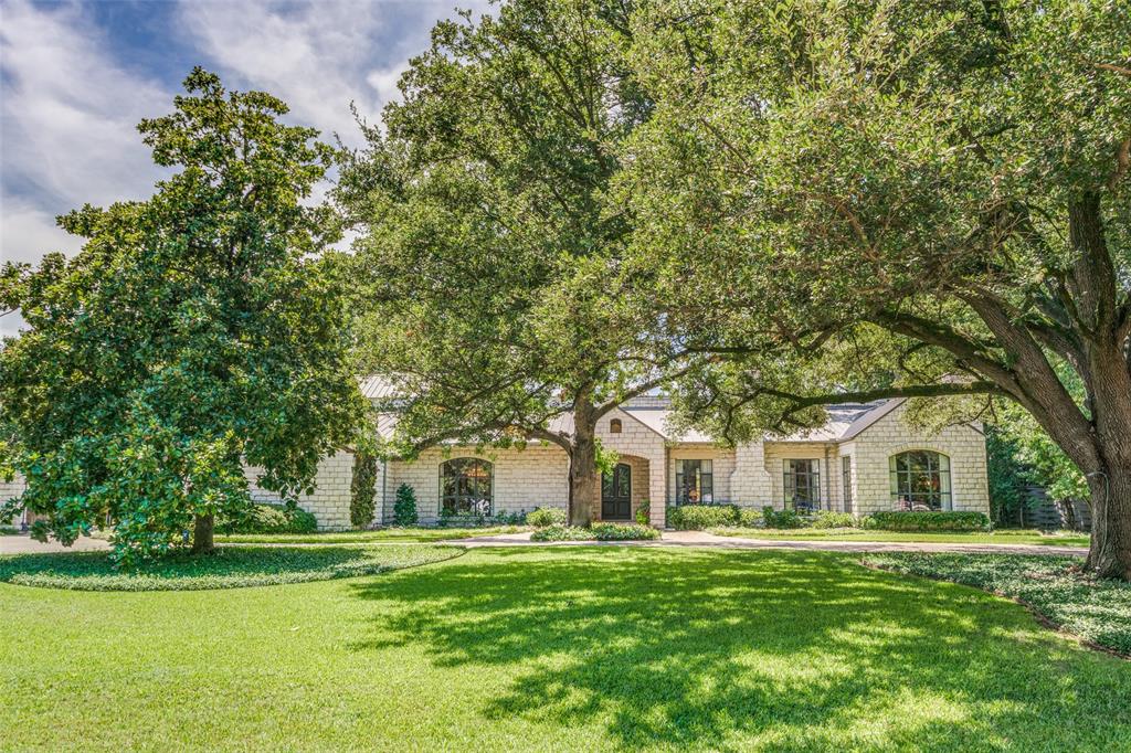 Custom designed Texas Hill Country oasis, filled with light, and open for family living and entertaining.  Circular driveway leads to large front entry porch, with custom front doors.  The wide entry, with views of the backyard, leads to large entertaining rooms with Venetian plaster walled rooms. The Venetian walls were done by Artisans from Santa Fe at the time of construction. The family room, with oversized fireplace, has a wall of windows overlooking the back yard and pool. The custom colored plastered dining room, with a dazzling chandelier, and over looking the landscaped front yard, is perfect for entertaining. Flanking the family room is an oversized den or study with built -ins, fireplace, and large windows also overlooking the front yard.   From the dining room, the butlers pantry leads to a large open cook's kitchen, featuring an oversized island, 6 burner Viking range with double ovens, built in grill, an additional oven, microwave, warming drawer, and Subzero refrigerator.  The wood burning fireplace completes the kitchen, and makes it a focal point of the home for family gatherings.   The primary suite features plantation shutters, wet bar, oversized closets and storage.  The primary bath, with separate vanities,  separate shower, jetted tub, and walk-in closets.
Second bedroom, located on the first floor is oversized with ensuite bath, sitting room and fireplace.  Two additional bedrooms with ensuite bathrooms and walk-in closets are located on the second floor. The oversized three car garage is attached with easy entrance to mudroom and full size utility room.   Above the garage, with private exterior entrance are quarters, with two bedrooms, sitting room, and kitchen.   This is an amazing custom built home located in upscale Preston Hollow.   It is an Estate owned property.  Contact listing agent for additional information.