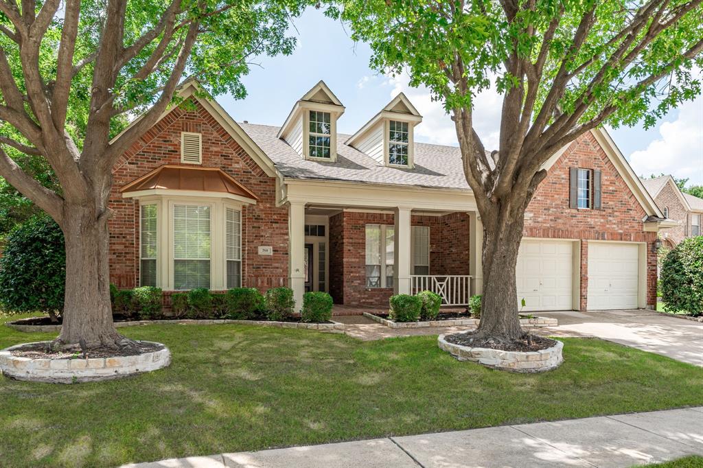 A sparkling backyard oasis takes center stage, where a stunning pool, towering mature trees, and an expansive covered outdoor living area create the perfect setting for relaxing or entertaining. Complete with a masonry fireplace, built-in gas grill, mini refrigerator, additional gas burner, and generous storage, this outdoor retreat is designed for year-round enjoyment. Perfectly positioned directly across from Stonebridge Ranch's scenic walking and jogging trails, this home offers the ideal blend of privacy, recreation, and convenience. Inside, rich wood floors, crown molding, built-in shelving, and walls of windows create a warm, inviting atmosphere. The living room is anchored by a beautiful fireplace and showcases picturesque views of the backyard, creating a seamless connection between indoor and outdoor living. A private home office and elegant formal dining room provide dedicated spaces for working from home and entertaining guests. Just off the main living area, a flex space offers endless possibilities for a study area, hobby room, playroom, or second office. The thoughtfully designed floor plan places all bedrooms on the first floor, including the private primary suite featuring dual vanities and a well-appointed ensuite bath. The bright kitchen blends style and function with white cabinetry, granite countertops, a center island, gas cooktop, and a sunny breakfast area surrounded by windows overlooking the backyard. Upstairs offers even more flexibility with a media room equipped with a projector and screen, full bath, and large walk-in closet, making it an ideal guest retreat, bonus room, or additional living space. From the exceptional outdoor living and highly desirable first-floor bedroom layout to the timeless finishes and prime location across from Stonebridge Ranch's walking and jogging trails, this home offers a lifestyle that's as comfortable as it is unforgettable. Recently updated carpet and paint.