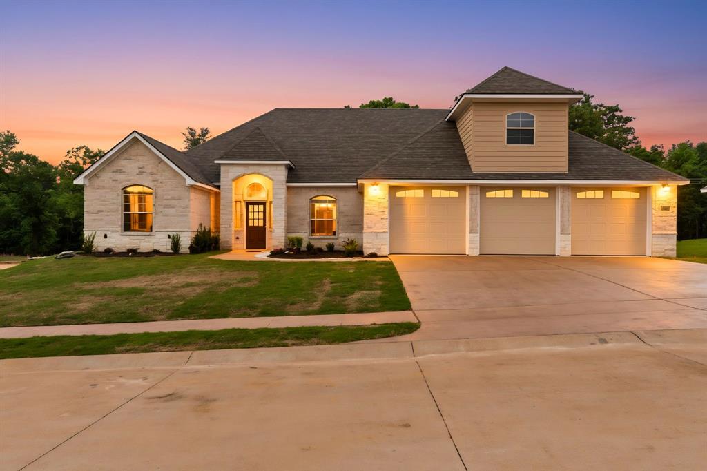 Welcome to this stunning new construction home located in the desirable Corrigan Trails community in Lindale, Texas. Offering 5 bedrooms, 4 bathrooms, and approximately 3,327 square feet of thoughtfully designed living space, this contemporary one-story home blends comfort, style, and functionality. The exterior showcases an attractive brick and stone façade that sets the tone for the quality found throughout the home. Inside, the spacious layout features a split master bedroom design, creating privacy and a relaxing retreat. A formal dining area and bright breakfast room provide multiple spaces for gathering and entertaining. The modern kitchen is equipped with gas cooking, a large walk-in pantry, and generous workspace, making it perfect for everyday living or hosting guests. Additional highlights include a dedicated office space, a bonus room, and the option for a 5th bedroom, ideal for guests or a home office, giving you added flexibility to suit your lifestyle.

This home is built with energy efficiency in mind, featuring spray foam insulation and Low-E double glazed windows for year-round comfort. Smart home features and a cozy brick fireplace enhance the main living area, creating a warm and inviting atmosphere. The home also offers a three-car front-entry garage and a covered patio complete with an outdoor kitchen stub-out, perfect for entertaining or enjoying peaceful East Texas evenings. Sitting on approximately 0.34 acres, the property provides a comfortable balance of outdoor space without the maintenance of larger acreage. Residents of Corrigan Trails enjoy access to neighborhood amenities including a community pool and the added security of a gated entrance. Located within the highly regarded Lindale ISD, this home combines modern construction with the charm and convenience buyers are looking for, with builder options available for a pool or detached workshop subject to terms agreed upon in the contract.