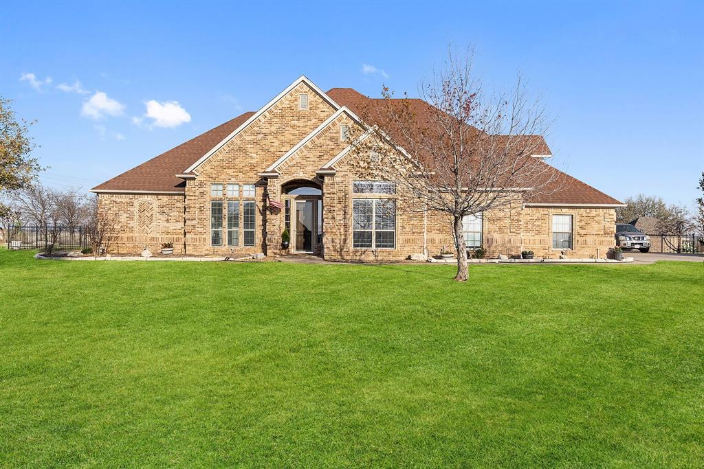 A location that can’t be beat! Situated on 1.49 acres outside city limits in the highly sought-after gated community of Harbour View, this home is less than one mile from Harbour One Marina at Eagle Mountain Lake. Store your boat nearby and enjoy true lake living, all while being zoned for the brand-new Eagle Mountain High School in one of the area’s top school districts. Designed for entertaining, the open floor plan is filled with natural light and offers seamless flow between living spaces. The spacious family room opens to a private backyard retreat featuring a gunite swimming pool and expansive green space. A dedicated garden area provides the perfect foundation for raised beds, landscaping, or outdoor entertaining tailored to your vision. The home office features built-in desk and shelving with coffered ceilings. The kitchen includes granite countertops, gas stove, generous prep space, and open to the main living areas. Three oversized secondary bedrooms are split from the private primary suite, which includes dual sinks and a walk-in shower. Upstairs offers exceptional flexibility with a media room, a private 5th bedroom ideal for guests or teens, and a second living area that can function as a game room, gym, or play space. Community amenities include a security gate, rolling hills, walking trails, park with jungle gym and fishing ponds. 
Rare acreage, gated privacy, lake access nearby, and versatile living space — don’t miss this opportunity!