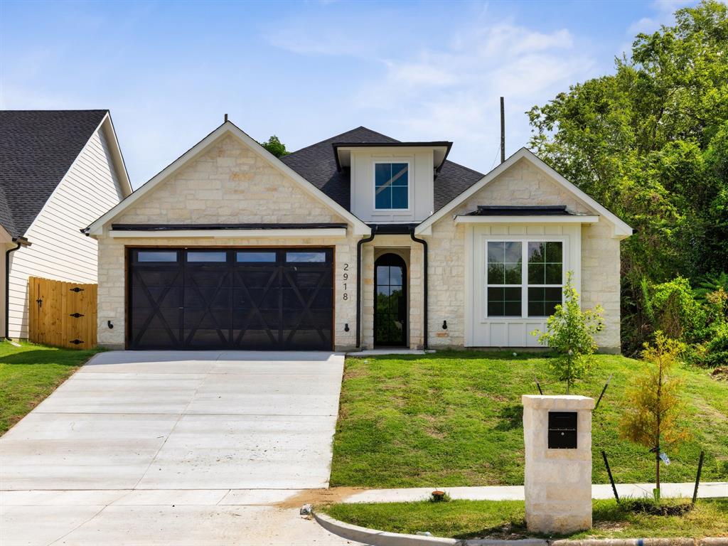Step through the custom iron front door into this brand new construction home in the heart of Fort Worth, where timeless design meets modern craftsmanship at every turn. One of six homes being built side by side by Arteaga Homes, each bringing its own custom design to the block, this residence stands out with vaulted ceilings, abundant natural light, and designer lighting throughout that set an elevated tone from the entry, while a striking limestone fireplace and statement chandelier anchor the living space with warmth and character. The kitchen serves as the heart of the home, featuring custom woodwork, quartz countertops, and a spacious island that flows effortlessly into the living and dining areas ideal for everyday living and entertaining alike. Four bedrooms and two full baths offer comfort and flexibility for family, guests, or a home office. Out back, a covered patio and shaded outdoor living area make relaxing or hosting easy any time of year. Minutes from the Stockyards with easy access to shopping, dining, and major highways, 2918 NW 20th Street is a home where the details do the talking; come see it for yourself!