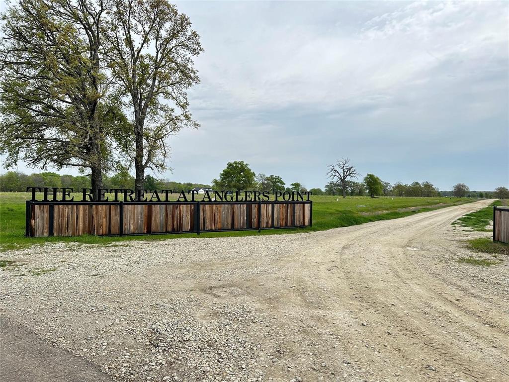 Discover the charm of lakeside living with this exceptional waterfront property in The Retreat at Angler's Point, nestled on the shores of Lake Fork. This prime lot, part of one of the newest neighborhoods around Lake Fork, offers an elevated position that promises stunning lake vistas and ample space to relish the great outdoors. You have a blank canvas awaiting your vision to craft the perfect lakeside residence on approx 1 acre adorned with mature trees. The property's gentle slope leads down to Lake Fork, allowing for the construction of your private pier and boathouse. This lot stands as a promising investment in what's set to become a standout destination. With utilities ready for connection, and Lake Fork's renowned fishing scene, this spot is ideal for fishing enthusiasts or those seeking the tranquility of waterfront living. An easy drive from the Dallas area, making it an ideal retreat. Plus, with proximity to nearby towns, you're never far from dining and entertainment opt.