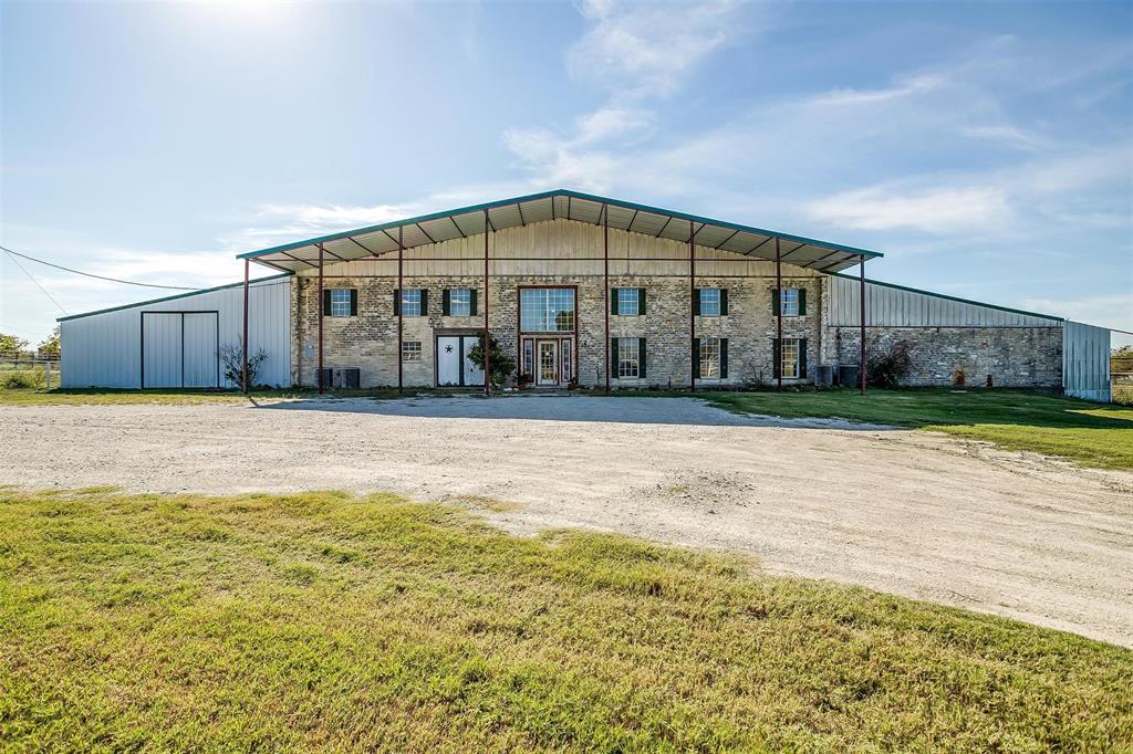 Exceptional 29.168-Acre Multi-Use Property with Highway Frontage
Discover a rare opportunity to own 29.168 acres of prime land with 798 feet of Highway 377 frontage, ideal for commercial, residential or agricultural ventures. This versatile property, located in Aledo ISD, and features a substantial 18,000 sq ft multi-use building, previously operated as a veterinary clinic, 14,000 sq ft is the dirt floor arena, with approximately 4,000 sq ft of enclosed space and 2,000 sq ft equipped with central heat and air. The building is serviced by a dedicated water well, ensuring reliable water supply.
The property is fully fenced and cross-fenced, offering flexibility for livestock, farming, or other uses. Located less than one quarter of a mile from the prestigious Blue Jack Ranch Golf Club, currently under construction, this site benefits from its proximity to a developing luxury destination. Whether you envision a commercial enterprise, agricultural operation, or a unique development project, this one-of-a-kind property offers endless possibilities. Don’t miss your chance to secure this exceptional investment.