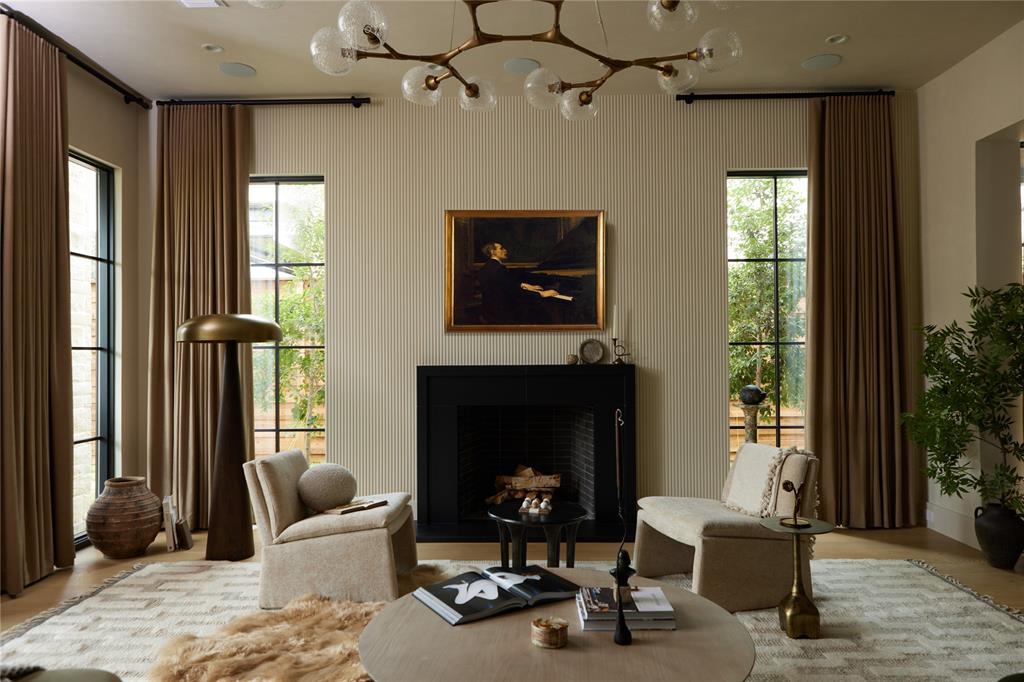 Now offered at $1,999,000, this exceptional Preston Hollow residence presents an incredible opportunity to own one of the area’s most beautifully designed homes. The property went under contract, but the buyer’s contingency to sell another home prevented that closing, creating a new opportunity for buyers ready to move forward.

Featured in the Dallas Morning News and curated by award-winning Urbanology Designs, this sophisticated home blends elevated design with everyday comfort. Located in a quiet gated enclave, this 4-bed, 4.5-bath residence offers an optional turnkey furnishing package, with designer pieces on the first level available for purchase separately. Showcasing wide-plank hardwood floors throughout, the open-concept layout is flooded with natural light and anchored by a chef’s kitchen featuring quartz countertops, soft-close cabinetry, a custom-designed hood vent, Sub-Zero built-in refrigerator, Wolf 6-burner gas range with griddle, and a butler’s pantry with a wine fridge and two cooler drawers. Upscale lighting, power blinds, and in-home surround sound add layers of luxury.

The living area is an inviting yet refined space with custom floor-to-ceiling drapery, a modern chandelier, and a sleek fireplace. Large windows and glass doors open seamlessly to both patios, creating the perfect setting for everyday lounging and entertaining.

The main-level primary suite is a spacious and serene retreat complete with a sitting area, custom drapery, a spa-inspired bath, and an expansive boutique-style walk-in closet. The office includes a built-in desk with custom cabinetry and shelving.
Upstairs includes three spacious bedrooms, each with an en-suite bath and walk-in closet, plus a large flex room and additional storage. This level offers a blank canvas to design a media lounge, gym, or guest retreat to suit your lifestyle.

Located in one of North Dallas’s most desirable areas, this home is minutes from shopping, dining, downtown, and both airports.