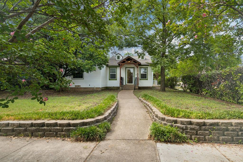 SUPER CLEAN AND MOVE_IN READY!!! Nestled in the highly sought-after Elmwood neighborhood, this charming traditional home perfectly blends timeless character with thoughtful updates, including an Arrington roof installed in 2025. The classic galley kitchen opens seamlessly to the dining area and features ceramic tile countertops, a decorative tile backsplash, and plenty of workspace for preparing your favorite meals. Original hardwood floors add warmth and authenticity throughout most of the home, while the cozy front bedroom offers plush carpeting for added comfort.  A covered patio provides the perfect setting for weekend barbecues, outdoor dining, or relaxing with family and friends. The fenced backyard offers endless possibilities, including three oversized raised garden beds ready for your vegetable garden, flowers, or creative landscaping ideas. The one-car garage provides not only parking but also ample space for a workshop, hobby area, or additional storage. PLEASE SEE LIST OF UPDATES IN TRANSACTION DESK. 

Ideally located in one of Oak Cliff's most beloved neighborhoods, you'll enjoy the charm of tree-lined streets, nearby parks, local restaurants, shopping, and easy access to downtown Dallas. This is a wonderful opportunity to own a home that offers character, comfort, and room to make it your own in the heart of Elmwood.