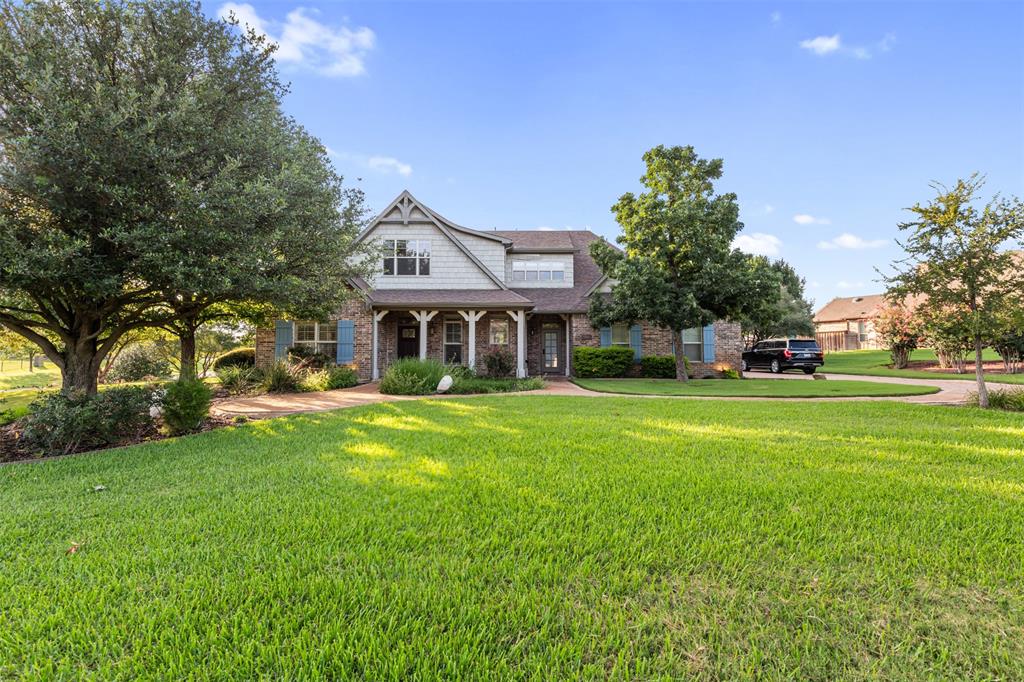 Experience European country charm in North Texas in this unique and lovely home. Located in the exclusive, gated community of Forest Hills, warmth and light exude from this picturesque residence. Situated elegantly on an oversized one acre lot and designed with exacting care, all of the comforts of home are found here. From the outstanding and innovative SIPS construction, vaulted ceilings and the extensive built in storage solutions, to the grandly designed summer kitchen, massive stone fireplace and flexible two story bonus building with oversized garage, the possibilities accompanying this home are nearly limitless. The lovely, landscape-architect designed grounds that surround the home are unsurpassed and seem to transport the owner and guests to a faraway land. Among the many superlatives befitting this exceptional property are: relaxation, comfort, flexibility, beauty, and design. As you will quickly come to understand, this is truly the perfect place to call home.