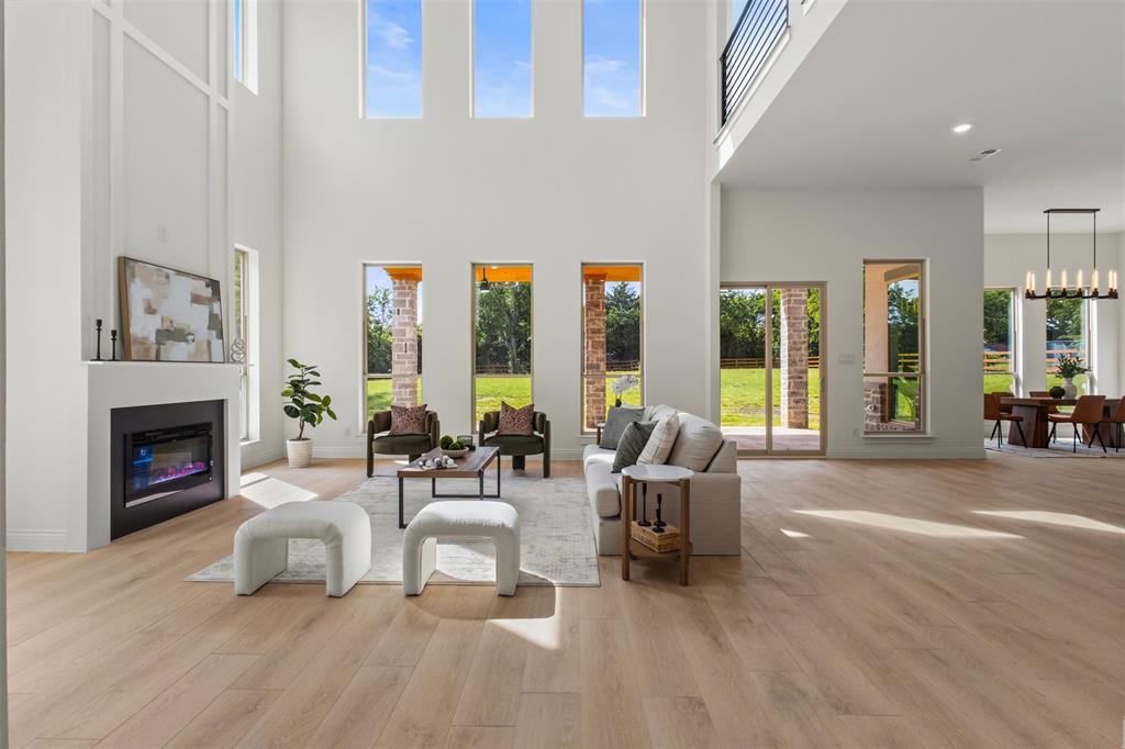Modern luxury meets exceptional craftsmanship in this stunning new construction home situated on almost an acre corner lot in one of Rowlett’s most desirable locations. Conveniently located just off President George Bush Turnpike and minutes from I-30, this property offers the perfect balance of privacy, space, and quick access to Dallas. Designed to impress, the home features soaring 22-foot ceilings, a unique two-story primary closet with a hidden door, and high-end finishes throughout. Built with quality and efficiency in mind, the home includes spray foam insulation, Class 3 impact-resistant shingles, reinforced structural walls, a full irrigation system, gutters, and a fully electric design.A rare bonus for the area, the property is connected to a brand-new city sewer system while many neighboring homes still utilize septic systems. Rich in local history, the lot was originally part of one of Rowlett’s founding family properties. With luxury finishes, premium construction, and a spacious 1-acre corner lot just 20 minutes from Dallas, this is a rare opportunity to own a truly one-of-a-kind home.