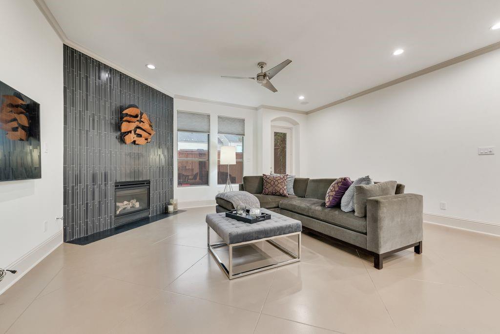 Access to Medical District • Open-concept layout • Steam shower + freestanding tub • Matterport 3D tour

3 bed, 2.5 bath townhome with 2,226 sq ft in Cedar Springs Heights with convenient access to Uptown, Oak Lawn, and surrounding Dallas employment and dining hubs. Main level features stained concrete floors, open living-dining-kitchen layout, and gas fireplace with floor-to-ceiling tile surround. Living area includes built-in speakers, recessed lighting, and crown molding. Kitchen offers granite countertops, stainless steel appliances, gas range, tile backsplash, extensive cabinetry, plus under-cabinet and upper cabinet accent lighting. Powder bath on first level. Walls, trim, doors, and cabinetry have been recently repainted, providing a clean and cohesive interior finish throughout.

Second level includes hardwood flooring in loft-flex space, full laundry room, and three bedrooms. Guest bedrooms include recently replaced carpet and share full bath. Primary suite features beamed ceiling and incredibly remodeled ensuite bath with custom cabinetry, integrated lighting, dual vanities, freestanding tub, and glass-enclosed steam shower with Mr. Steam system. Walk-in closet in primary.

Additional features include two-zone HVAC with Nest thermostats, recessed lighting throughout, and attached 2-car garage with storage. Outdoor patio offers a low-maintenance urban retreat. Interior layout supports multiple living or work-from-home configurations with separation between primary and secondary bedrooms. Located within established Cedar Springs Heights with access to retail, dining, and major thoroughfares. Includes Matterport 3D tour and floor plan.