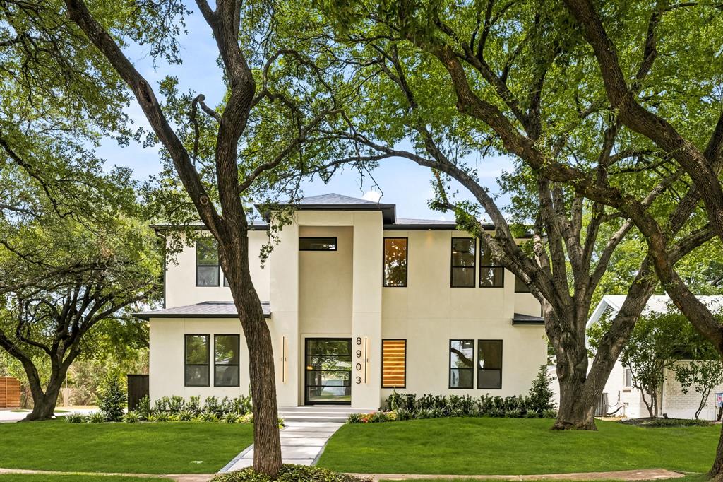 8903 Liptonshire is tucked into the L Streets of Lake Highlands—one of the most sought-after pockets in Dallas—and this custom build checks all the boxes.

The layout is intentional from the jump. Right off the entry, a glass-enclosed office keeps your workspace feeling open and airy without the distractions of the main house. At the heart of the home, the kitchen anchors the living area around a massive island, perfectly positioned so the chef is always part of the conversation. A wide horizontal window above the counter frames the backyard like a piece of art, pulling in natural light and keeping you connected to the outdoors.

The downstairs primary suite is a true departure from the everyday. It’s a dedicated retreat featuring a spa-caliber Japanese wet room, a closet that doubles as a high-end dressing room, and its own private laundry. Upstairs, the scale remains just as impressive with four additional bedrooms, each featuring its own en suite bath and walk-in closet. Two of these rooms are sized like secondary primaries, showcasing distinct design personalities—one finished in bold black tile and the other in a modern gray concrete aesthetic. A large gameroom with a built-in bar serves as the upstairs hub, flanked by a versatile flex space ready to become a theater, gym, or golf simulator.

Practicality is woven into the luxury, too. A secondary utility room comes equipped with a sink and a dedicated dog wash for easy clean-ups. Even the garage is over-engineered—spanning nearly 600 square feet with spray foam insulation and full climate control, it’s far more than just a place to park. Outside, a covered patio and electric privacy gate round out the property