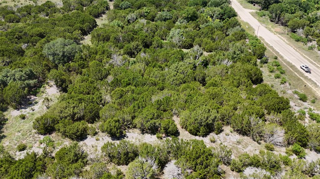 Step into a rural retreat designed for the discerning dreamer: a beautiful 2-acre tract in Sunrise Mountain Ranch, a gated enclave just outside Stephenville in scenic Erath County. Imagine your future home sheltered among mature trees, the crisp country air surrounding you, and evenings where the sky reveals a blanket of stars. Here, you’re free to design your lifestyle whether that’s a custom home, a weekend escape, or a place where family gathers and memories grow. The community offers a thoughtful blend of peace, privacy, and purpose with paved roads, utilities available, and amenities like community ponds and pavilions that make daily life feel like a getaway. Yet you won’t feel isolated you’re just minutes from town, restaurants, shopping, and all the charm of Stephenville. With this property, you get the excitement of crafting something special and the ease of being within reach of urban conveniences. It’s the perfect stage for whatever next chapter you imagine: outdoor hobbies, hobby ranching, quiet evenings, and mornings with coffee on the porch. The land awaits your vision. The surroundings invite relaxation. Your future begins here at Sunrise Mountain Ranch.
