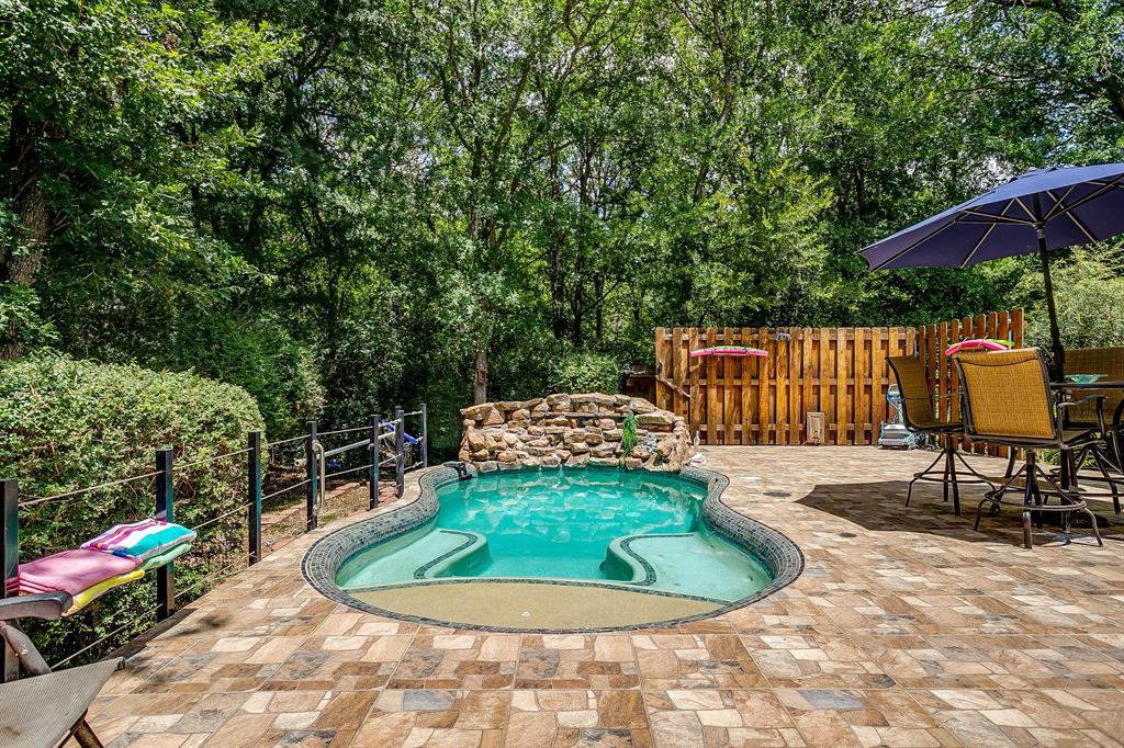 Escape to peaceful country living without sacrificing convenience! Nestled on a private, tree-filled acre in the highly desirable Turtle Creek Ranch community, this beautiful 3-bedroom, 2-bath brick home offers the perfect blend of comfort, space, and outdoor living with no HOA! Inside, you'll love the open floorplan featuring teak wood laminate flooring, a cozy wood-burning fireplace, and a spacious kitchen complete with granite countertops, farm sink and a walk-in pantry. The generous primary suite offers a relaxing retreat with a large ensuite bath and walk-in closet. Step outside and discover two incredible spaces for entertaining, a welcoming front deck perfect for morning coffee and a large covered back porch overlooking a refreshing cocktail pool, creating your own private backyard oasis. Surrounded by mature trees, you'll enjoy the peace and privacy this property provides while still be close to shopping, schools and restaurants. Need room for your toys or hobbies? The oversized shop is ideal for boat or RV storage, and an additional storage shed offers even more space for tools and equipment. BONUS, no electric bill with solar panels that are paid off! If you've been looking for a property that combines country charm, modern comfort, and room to spread out, this is one you won't want to miss!