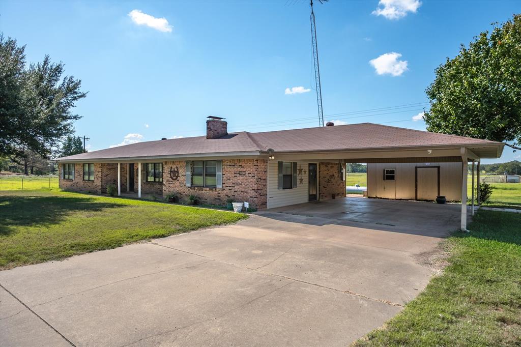 Located in the highly sought after Canton Independent School District, this property offers a well maintained three bedroom two bathroom home surrounded by open pastures and natural beauty. With no homes in the immediate vicinity, you will enjoy a rare sense of privacy and tranquility that is hard to find. Step inside to discover two spacious living areas that provide flexibility for both entertaining and everyday living. One living area features a cozy wood burning fireplace that creates a warm and inviting atmosphere, perfect for relaxing evenings at home. The expansive kitchen is a true highlight, complete with custom wood cabinetry, abundant countertop space, and ample storage, making it ideal for cooking, hosting, and gathering with family and friends. Outdoor living is just as impressive with a large covered deck stretching across the back of the home, offering the perfect space to unwind, entertain guests, or take in the peaceful views of the surrounding countryside. The property also includes a two car carport and a storage building, adding both convenience and functionality. For buyers seeking even more space, an additional six acres are available for purchase, providing endless opportunities for expansion, recreation, or enjoying the freedom of country living. See MLS 21224326 for additional details.