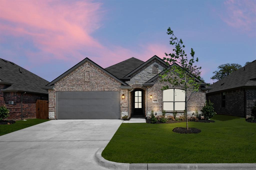 MLS# 21177378 - Built by Risewell Homes - Ready Now! ~ This thoughtfully planned single-story home offers a comfortable and efficient layout ideal for everyday living. The open family room serves as the central gathering space and flows seamlessly into the kitchen and breakfast nook, creating a bright and inviting area for entertaining or relaxing. The kitchen features ample counter space, a functional layout, and convenient access to the pantry and utility room. The private owner’s suite is tucked away for privacy and includes a walk-in closet and a well-appointed en-suite bath with dual vanities, a soaking tub, and a separate shower. Two additional bedrooms are grouped along the opposite side of the home with access to a full bath, making the layout ideal for family members or guests. A welcoming foyer, covered front porch, and a two-car garage complete this well-balanced home, perfectly suited for comfortable living in Granbury.